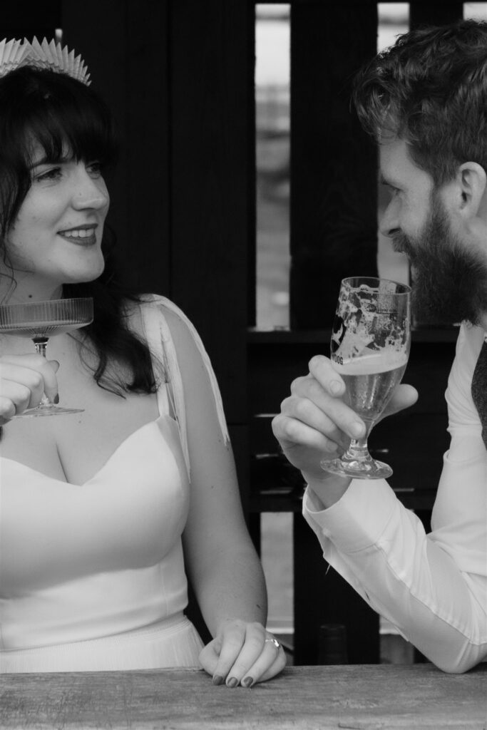 candid documentary wedding photographer uk scotland black and white photo with wedding day drinks